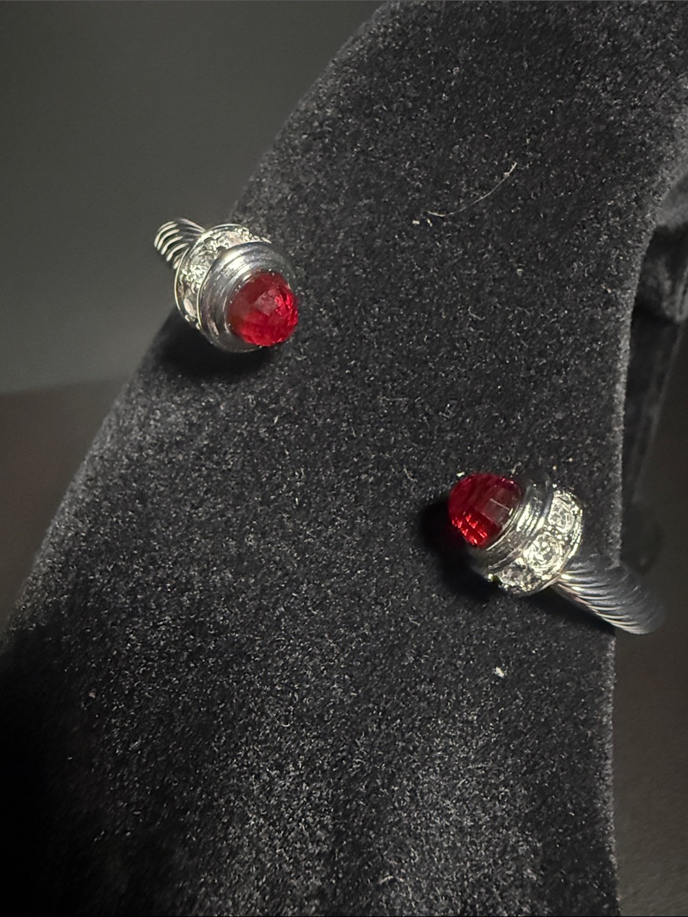 Silver-Tone Twisted Cuff Bracelet with Red Gemstone Accent